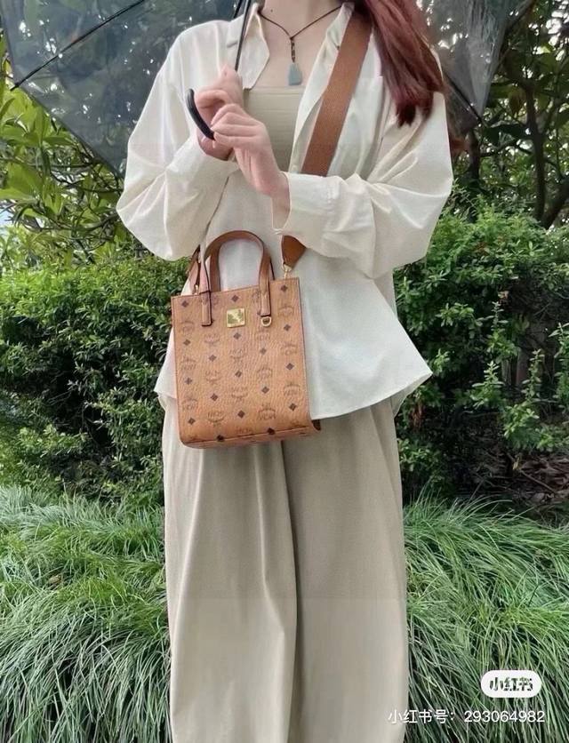 Mcm Handbag With A Dog Charm. Mcm's New Handbag Is So Convenient And Practical!