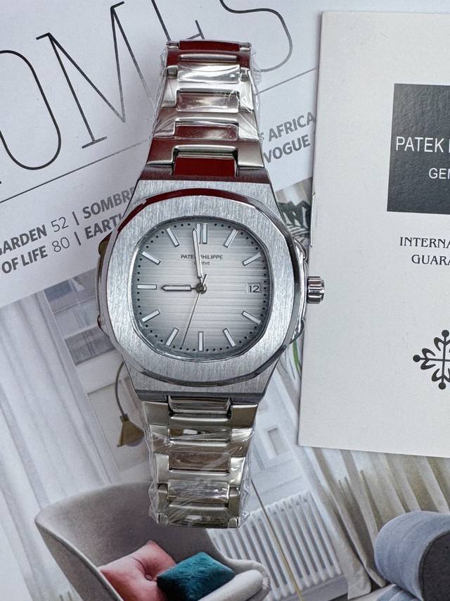 Patek Philippe Mechanical Watch With White Dial, Steel Bracelet, And White Face,
