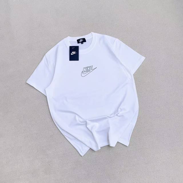 Nike Nike Perforated Small Logo Unisex Couple T-Shirt. Colors: Black, White. Siz