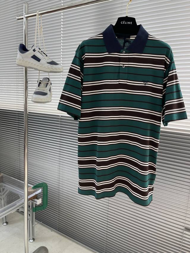 Prad 25 New Color-Blocked Striped Polo Shirt. This Polo Shirt Features A Classic