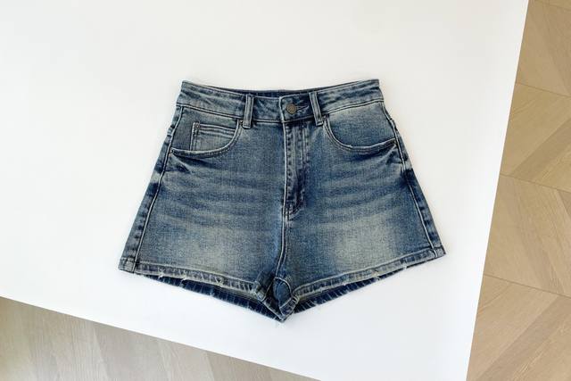 Denim Shorts. Retro Washed Blue Tones With Distressed Effect. Showing A Casual A
