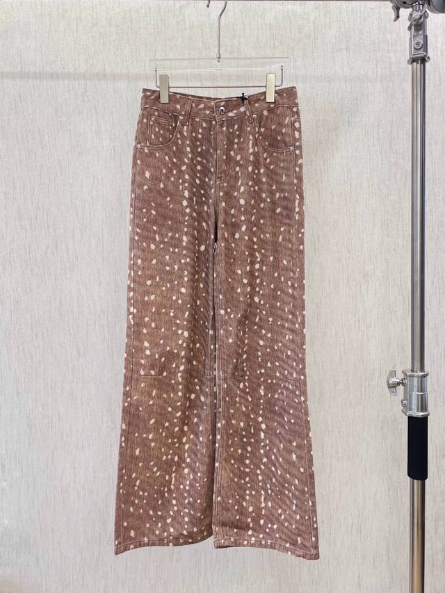25 Brown Wide-Leg Jeans With White Spots. The Pants Have Classic Denim Pocket