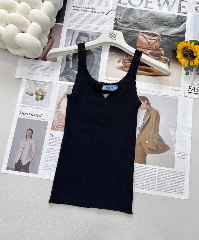prada's New Triangle Logo Lace Knitted Vest Is Presented In Classic Black And