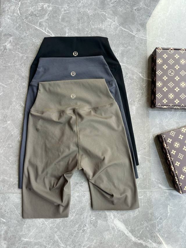 Lulu's popular reflective yoga shorts Color: black, gray, light brown = dark gre