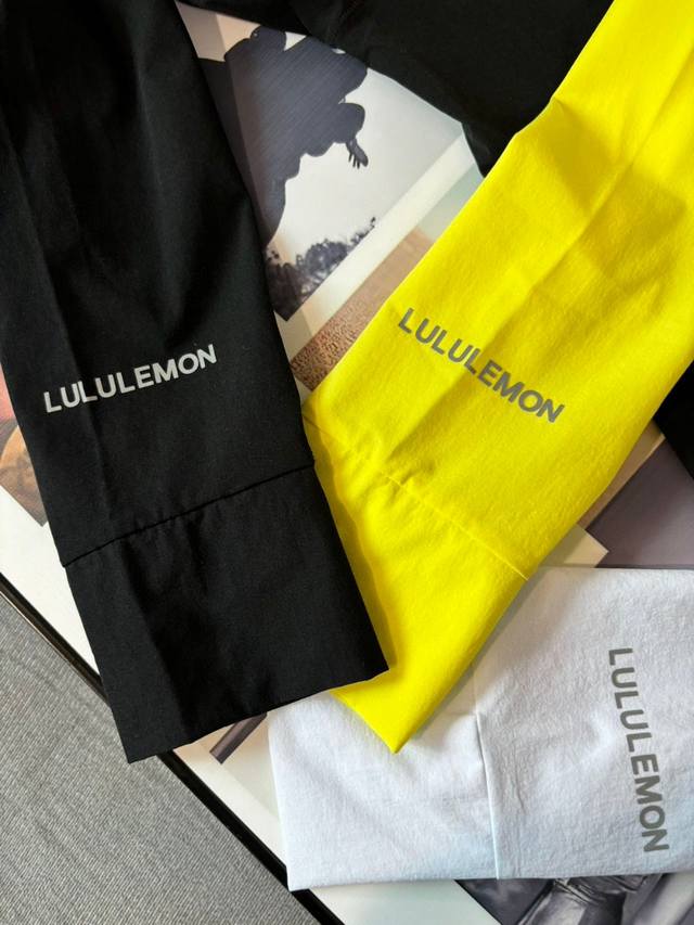 Details of Lululemon's sun-protective clothing. Logo letters on the sleeves of t