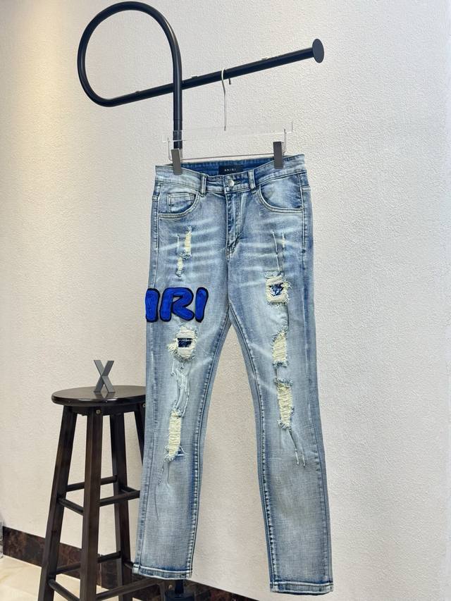 Style No. X135 Amiri blue patch letter hole skinny jeans, top version Same style