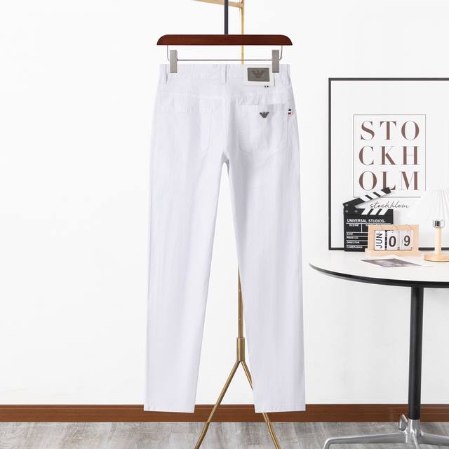 The classic and versatile Amani jeans have a custom hardware logo on the back po