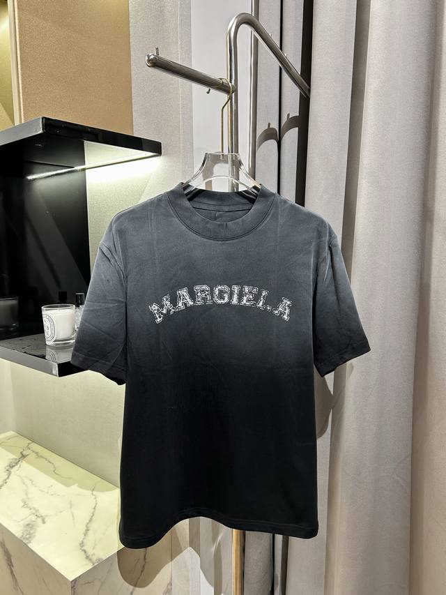 Margiela's distressed Logot shirt, mottled offset letter short sleeves, a fashio