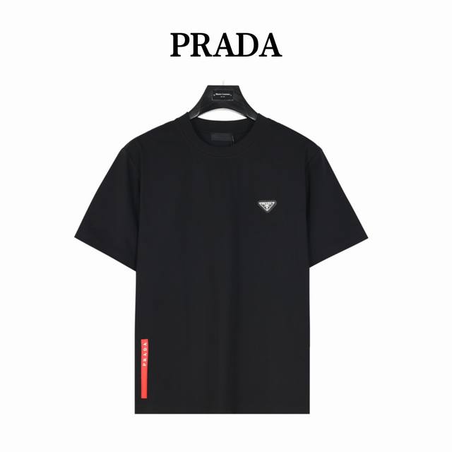 Prada Prada's triangle logo on the chest and red stripe on the back hem. The log