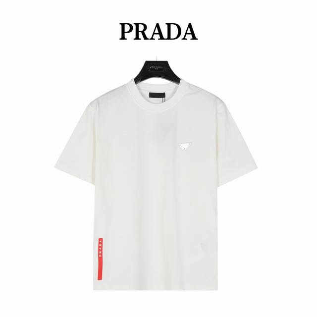 Prada Prada's triangle logo on the chest and red stripe on the back hem. The log