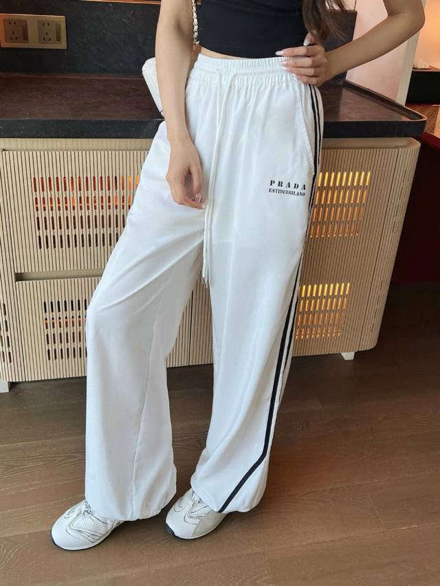 Prada letter print contrast color webbing drawstring elastic waist trousers Styl