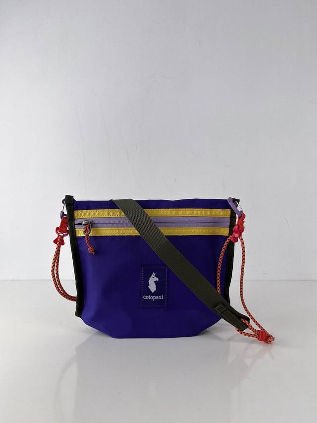 The Cotopaxi small crossbody bag that is often asked about, never loses when I g