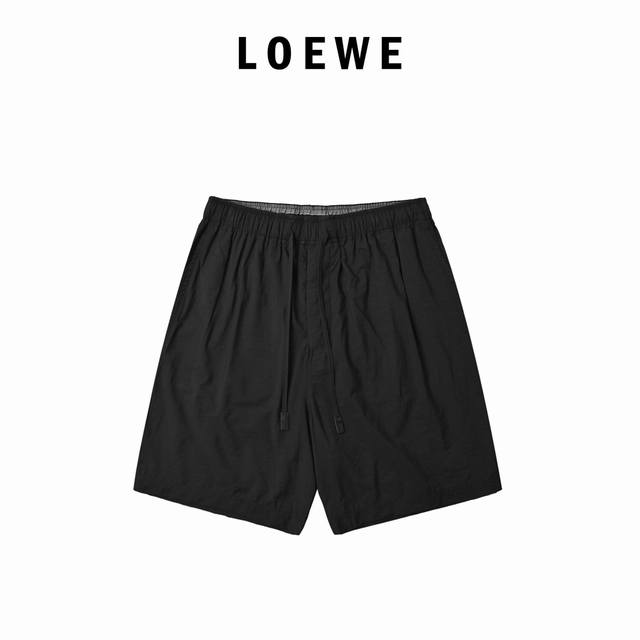 Loewe back pocket hollow embroidery shorts are made of a blend of 32% nylon and