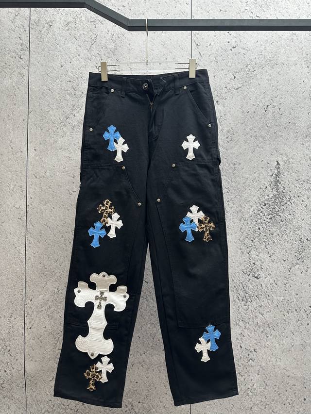 Black overalls with a distinctive Chrome Hearts style. Chrome Hearts is a well-k