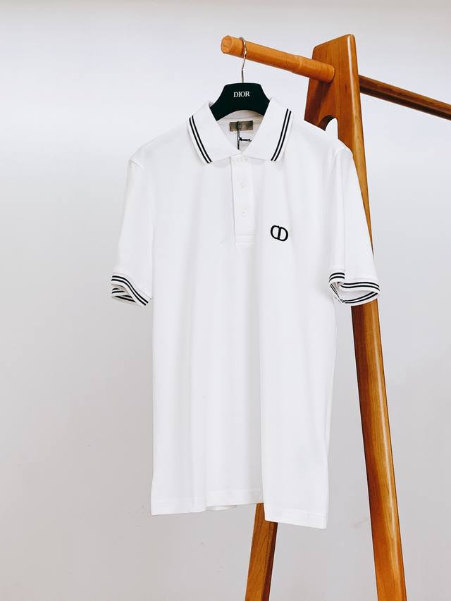 Dior Homme Cd Icon embroidered lapel polo shirt. Unconventional fabric cutting a