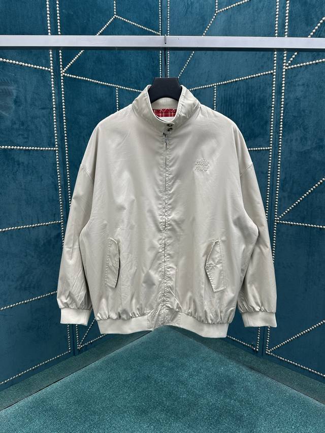 The new Miumiu 25Ss Oversized bomber jacket is made of Panama cotton and feature