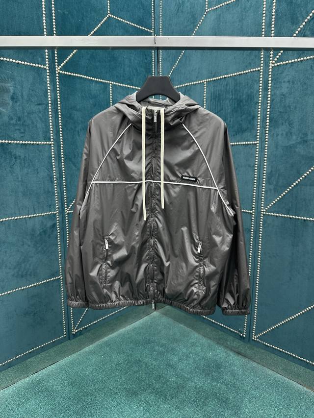 Miumiu 25Ss new zippered short jacket with silk technical fabric outlines a dyna