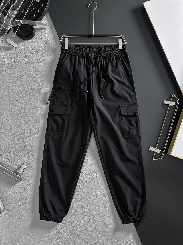 Bbr Black cargo pants with cuffs are cool and practical. Classic black will neve