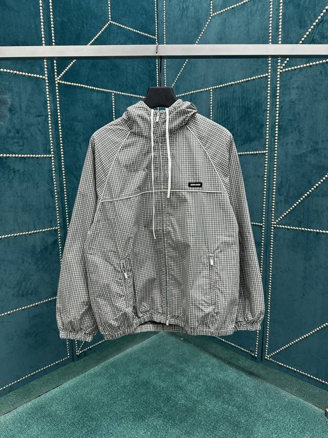 Miumiu 25Ss A new take on the classic check pattern, reinterpreted in an experim