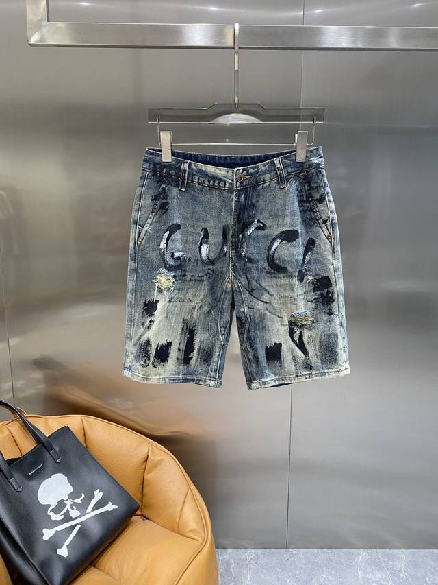 Gucci Gucci denim shorts, trendy and distressed with graffiti letters, full of s