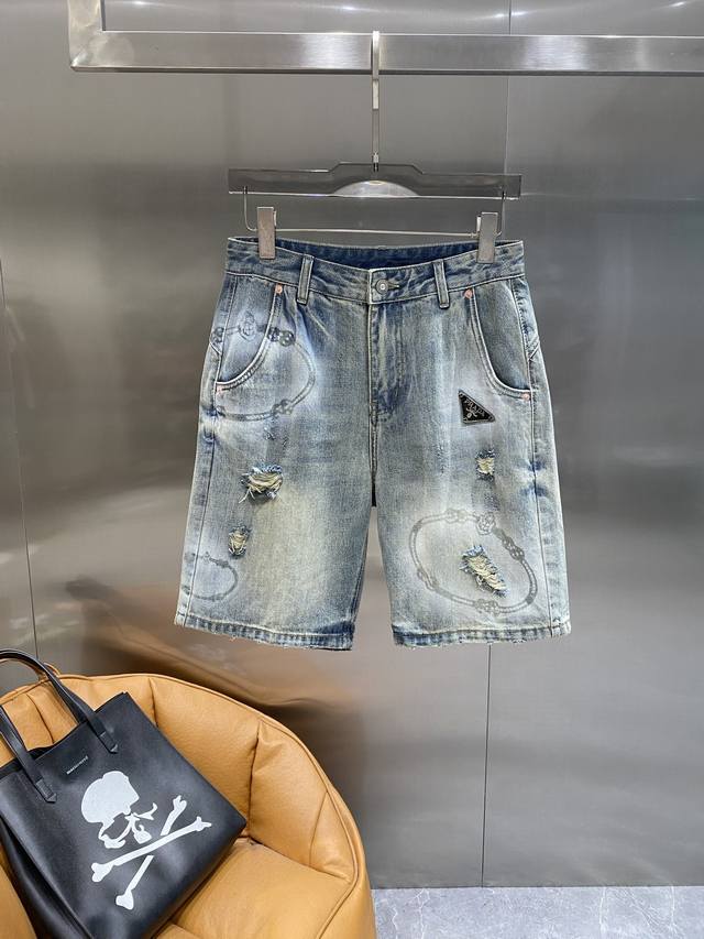 Pujia Prada denim shorts, trendy and distressed with graffiti letters, full of s