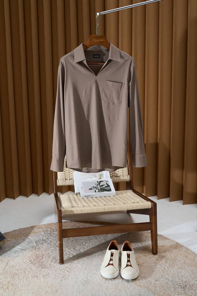 A must-have for your summer wardrobe! Zegna's large V-neck casual shirt opens a