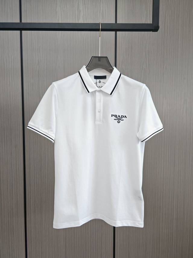 Prada. Embroidered classic Polo shirts are available at the counter at the same