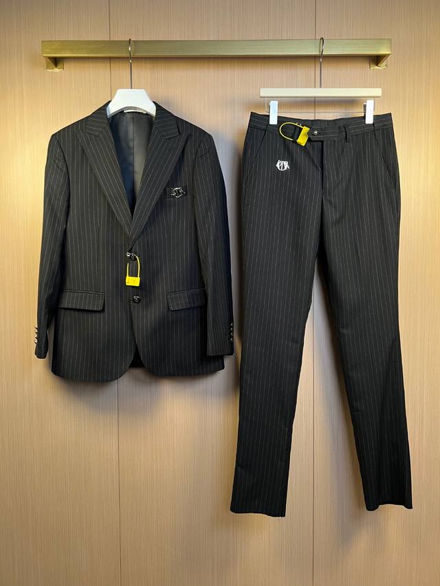 A set of Dr Dior's new striped suits with custom-made Dior logos on the pockets