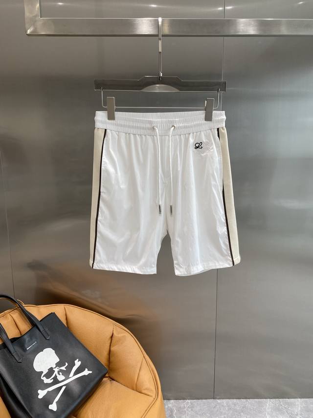 Luojia Loewe shorts are simple in design + contrasting colors on the sides, givi