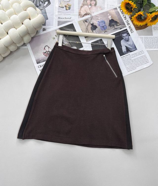 Miu Miu's new letter embroidered zipper skirt continues the brand's classic styl