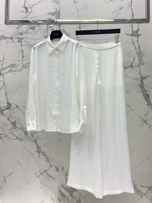 Saint 2025 family silk natural pleated shirt paired with wide-leg pants of the s