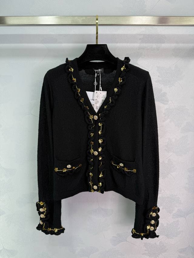 Chane* Black knitted cardigan with heavy gold sequins decoration. The cuffs and