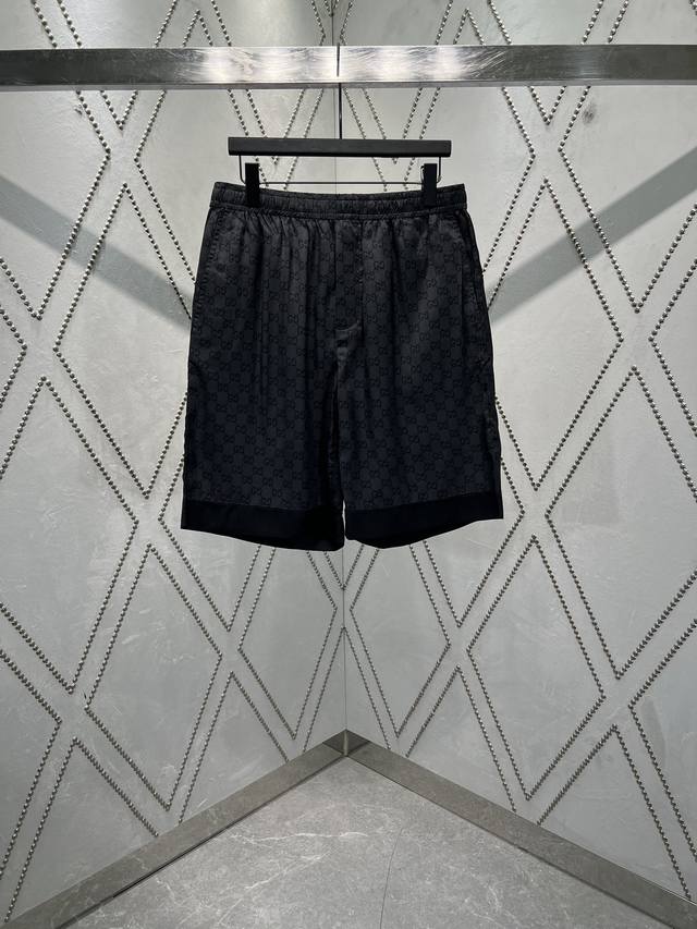 G's new 25Ss shorts are made of grey and black twill silk with Gg print all over