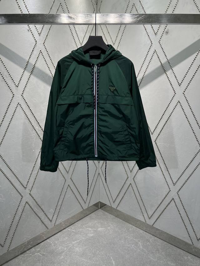 PRADA25SsThe new tech-inspired bomber jacket features a light, sporty design and