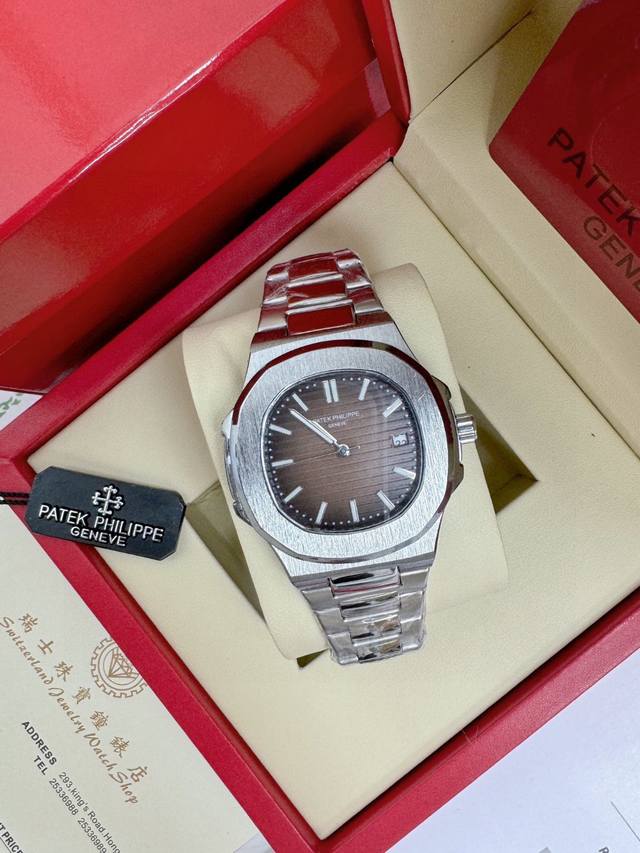Patek Philippe mechanical watch with brown dial, steel strap and brown surface,