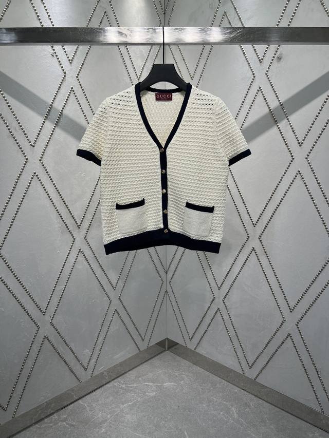 G 25Ss The new exquisite crochet top features navy blue contrast piping, adding