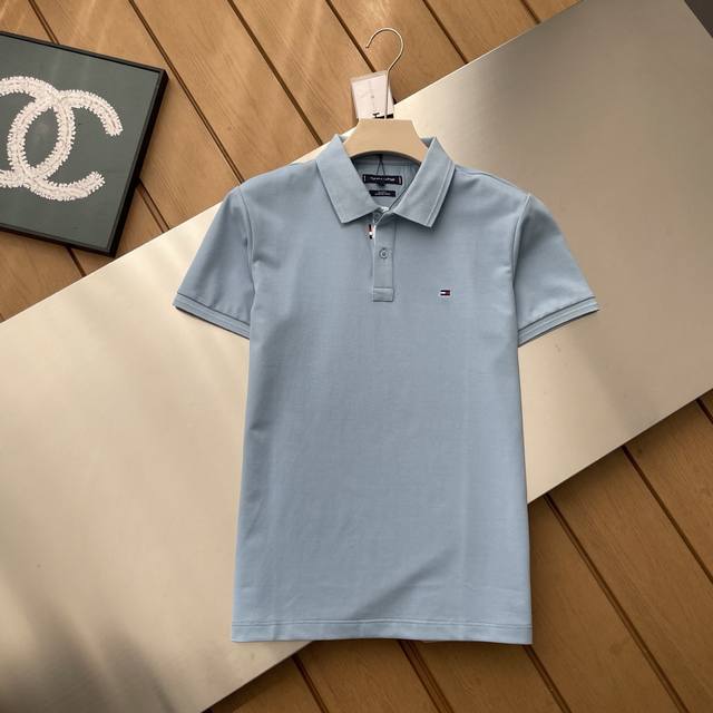 The counter restores the top replica version of Tommy's latest men's short-slee