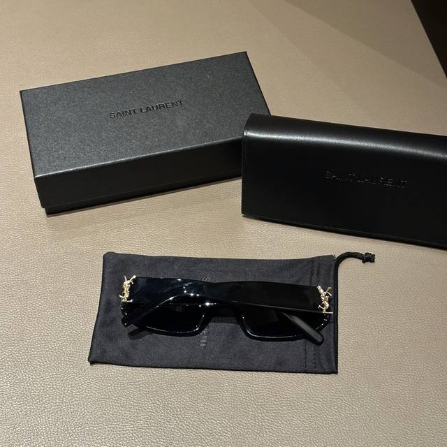 The YSL black-framed cat-eye sunglasses have a cool logo on the side, giving me