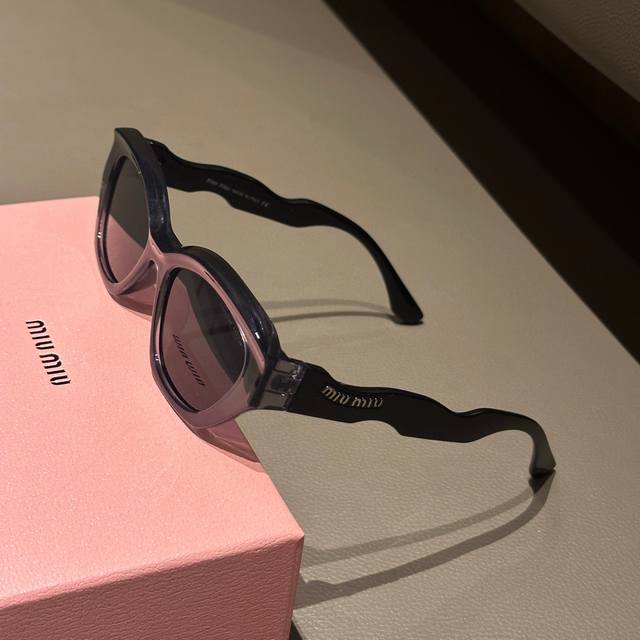 Miumiu Miu Miu retro cat-eye fashion sunglasses with letter temples showing exqu
