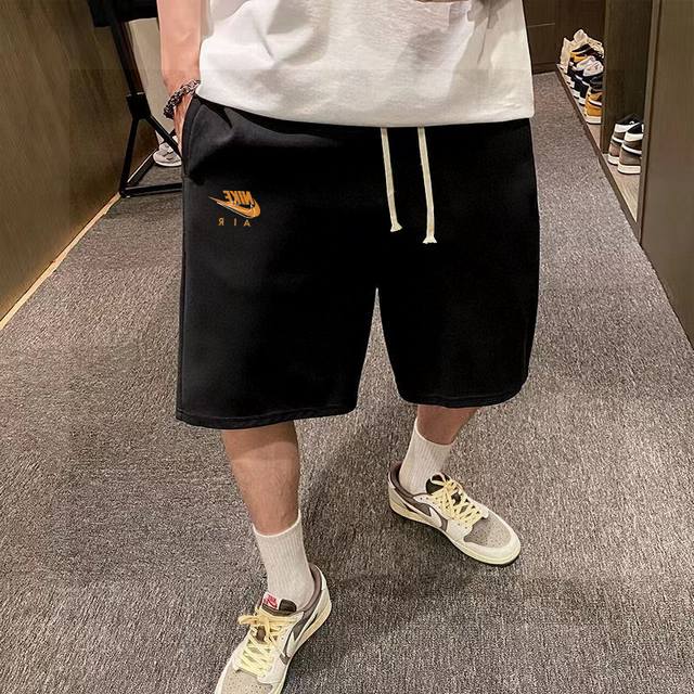 Nike's latest basic orange logo hollow letter print shorts for men and women cou
