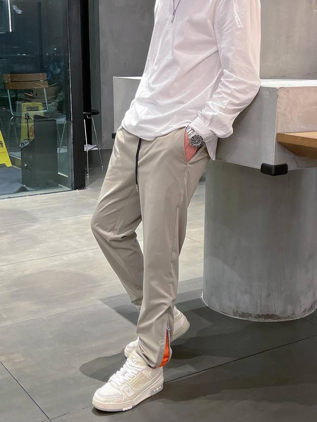25 Spring and Summer new style. Men's casual pants. Classic orange color on the