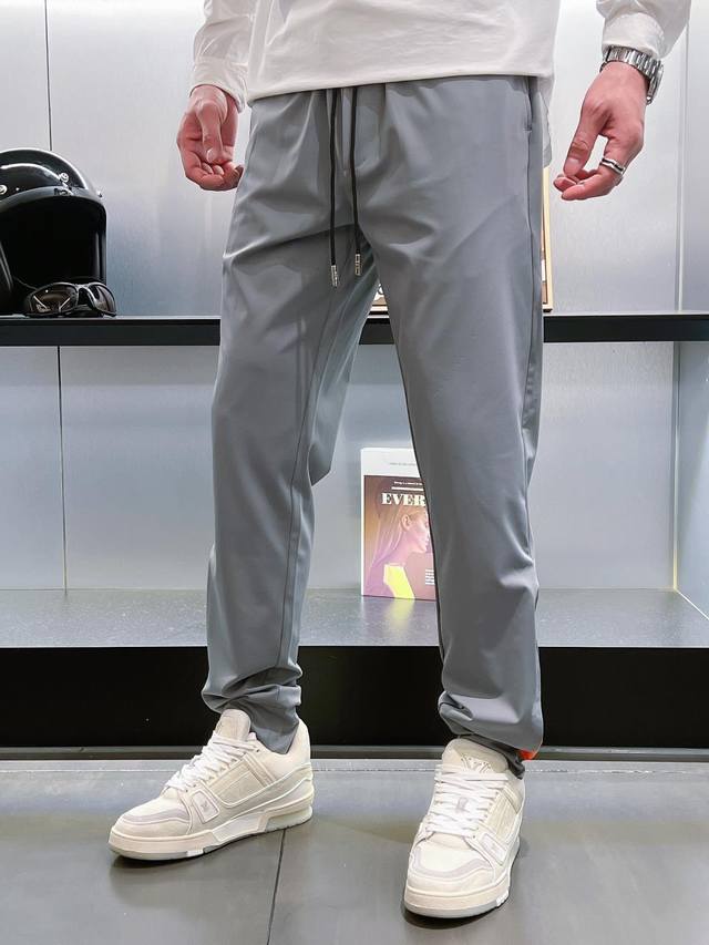 25 Spring and Summer new style. Men's casual pants. Classic orange color on the
