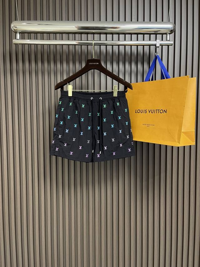 Lv 2025Ss new beach shorts, with side slits made of technical fabrics and embroi