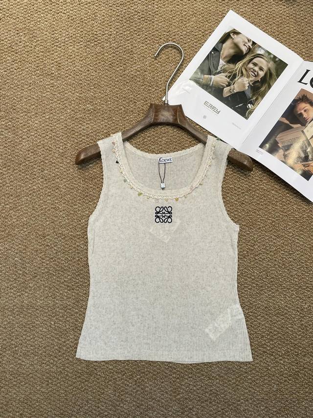 Loewe's new knitted vest, gentle milk apricot color with a soft light filter, lo