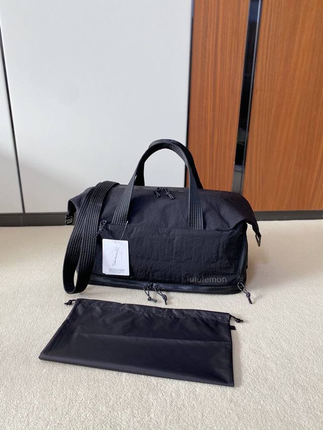 Lulu's new Gym Duffle Bag can be carried by hand or crossbody. It comes with a h