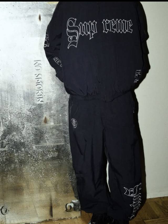 Supreme Ss25 Week12 Old English Track Pant with embroidered patterns on the legs