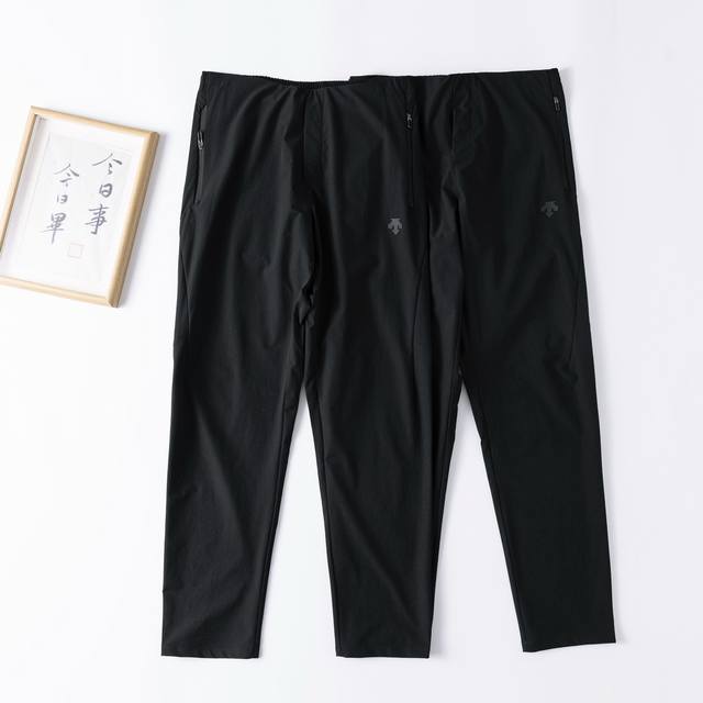 for the Descente 2025 Men's Outdoor Quick-Drying, Wide-Fit Woven Sports Pants. T