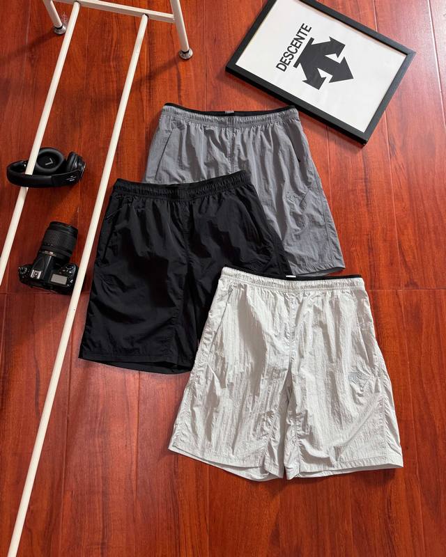 High-Release Descente Men's Running Woven Shorts. These casual shorts are from t