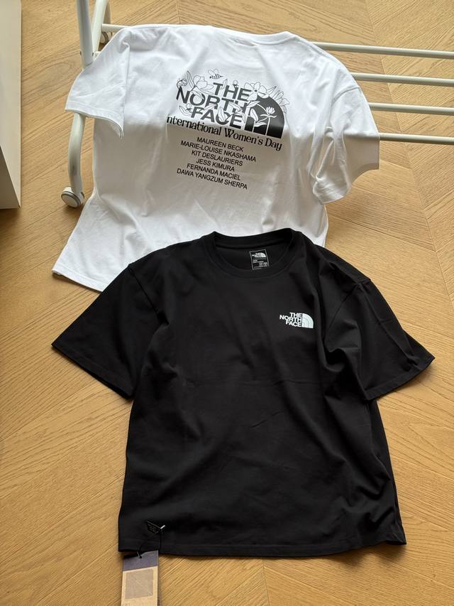 The North Face floral and letter print short-sleeved t-shirt. Unisex black and w