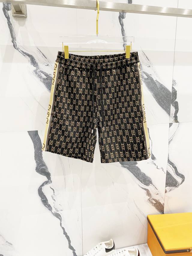 Gucci custom jacquard shorts featuring the classic GG logo printed all over with